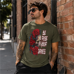 Man wearing Be A Rose In Your Darkness Military Green graphic tee with skull and red roses design in an urban setting – Black Heart Tees motivational apparel
