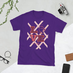 Purple t-shirt with 'LOVE' graphic on a light gray surface with accessories.