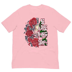 Be a Rose in Your Darkness graphic tee in Pink – rose and skull artwork representing strength and perseverance (Front View)