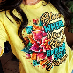 Black Heart Tees Bloom Where You’re Planted T-shirt with vibrant floral artwork with motivational text message
