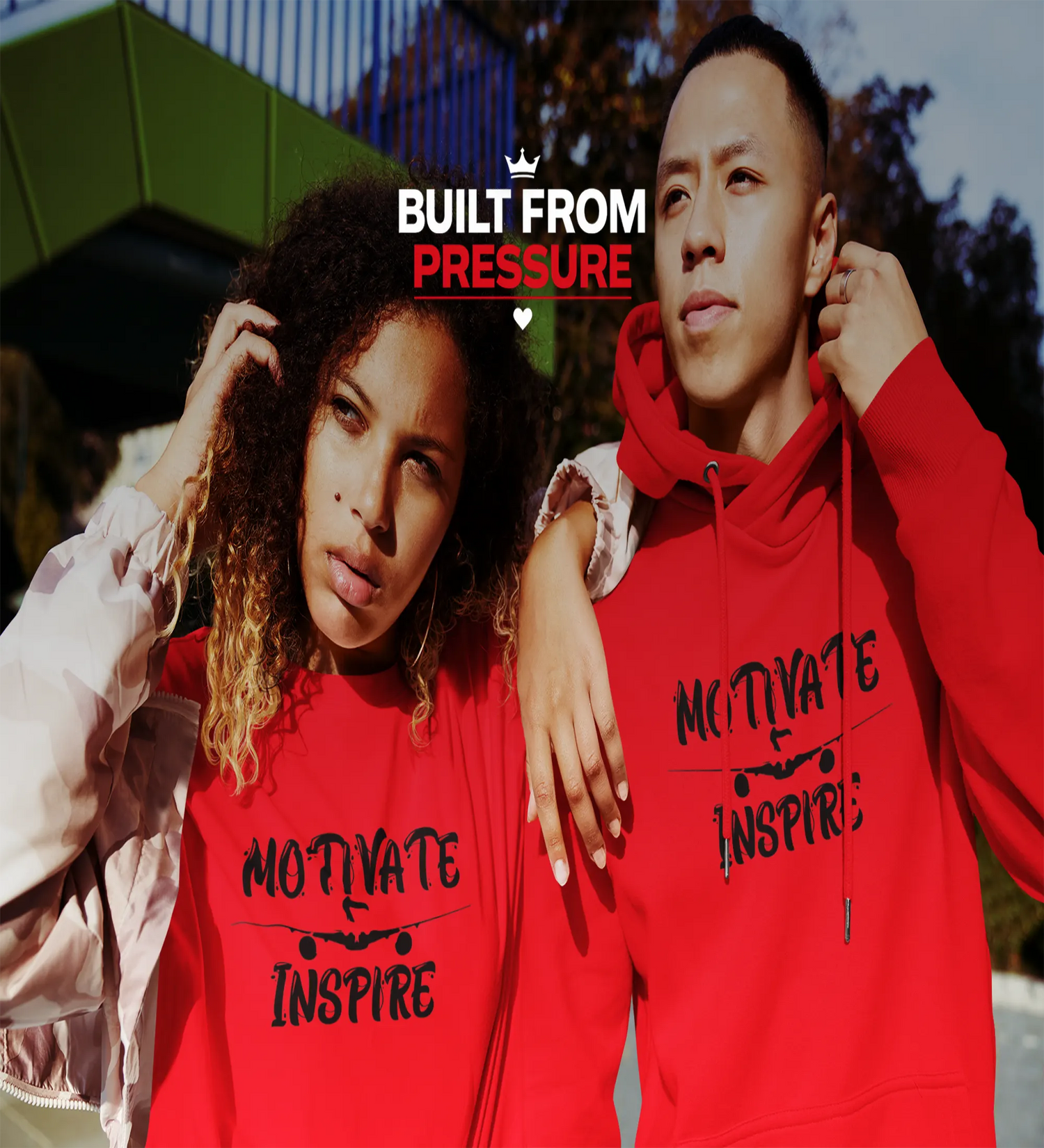 Man and woman wearing Black Heart Tees hoodies and t-shirts, representing resilience and the Built From Pressure motivational clothing movement.