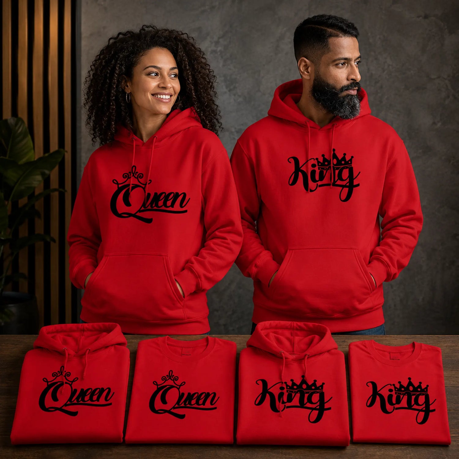 Queen and King red hoodie and tee bundle lifestyle display featuring matching graphic apparel